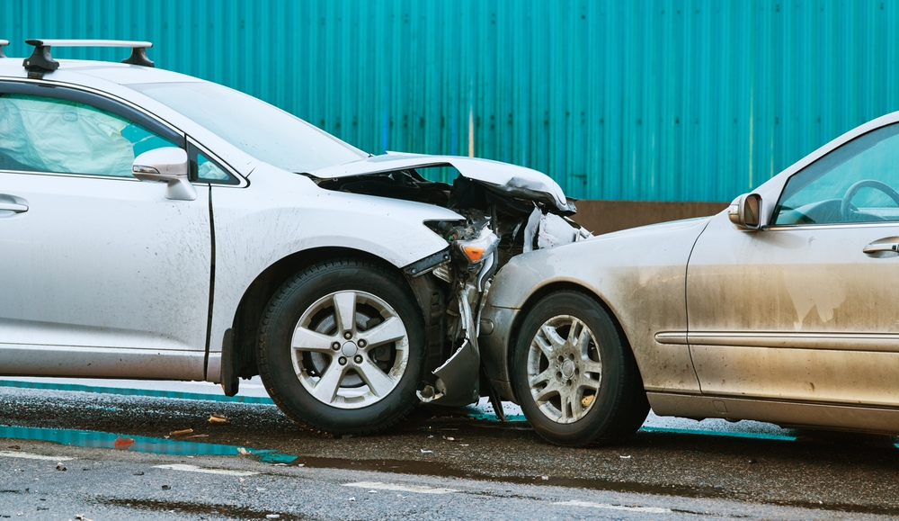 car collision accident on street. Two cars crashed in front